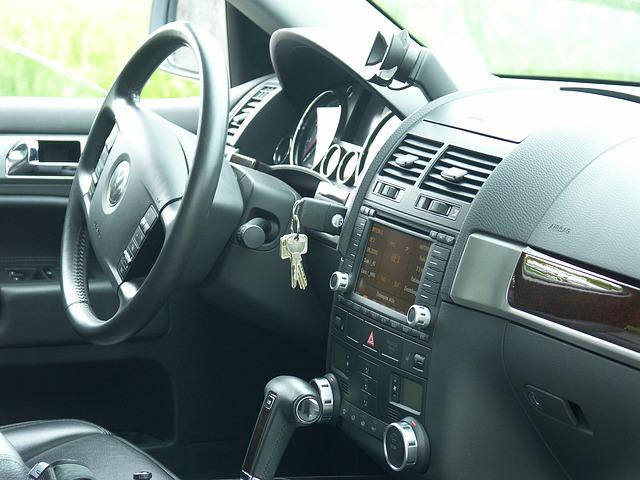 car interior with keys in ignition - cheapest way to rekey a car