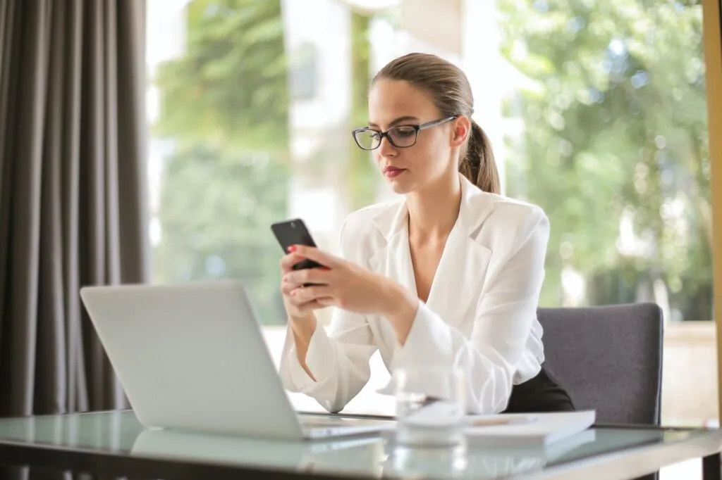 woman on phone - what to look for in a locksmith